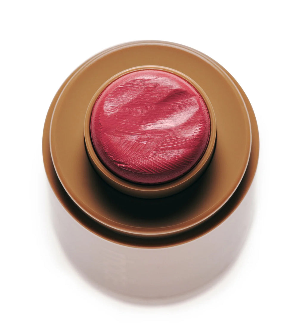 Swipe the creamy balm directly onto the apples of your cheeks or lids for an instant, dewy flush.
