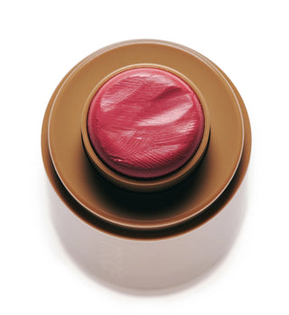 Swipe the creamy balm directly onto the apples of your cheeks or lids for an instant, dewy flush.